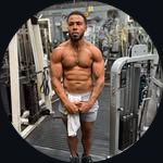 Marcel posing in a gym.