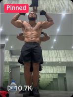 Marcel flexing in a gym.