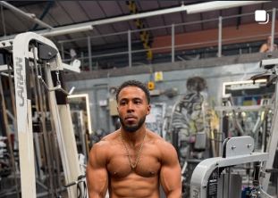 Marcel in a gym among the equipment.