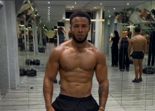 Marcel posing in a gym mirror.