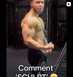Marcel showing a side pose in a gym.